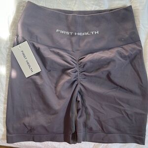 First health gym shorts, NEW, Medium but fits Large